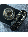 Top hybrydowy Bronze Snow NAILSOFTHENIGHT z nieregularnymi miedzianymi cząsteczkami na tle butelki